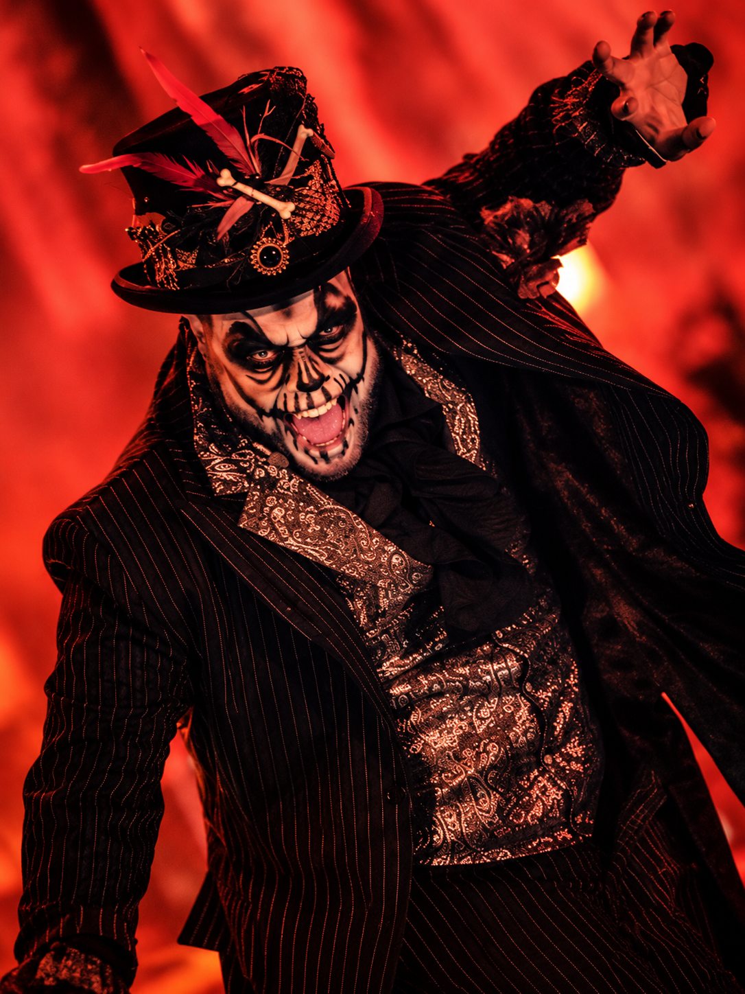 Dedrick Bonner as Baron Samedi snarls out of a blood-red glow — Voodoo: Bayou's Edge, Knott's Scary Farm 2026