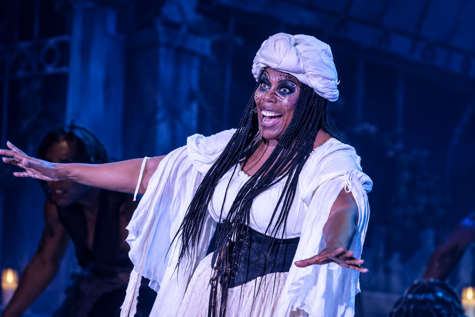 Regina Levert as Marie Laveau welcomes the dead, arms wide — Voodoo: Bayou's Edge, Knott's Scary Farm 2026